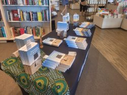 Books set up on a table for a book signing event