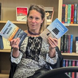 Author discussing her books at a reading